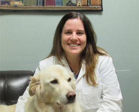 Dr. Sarah Wells with a dog